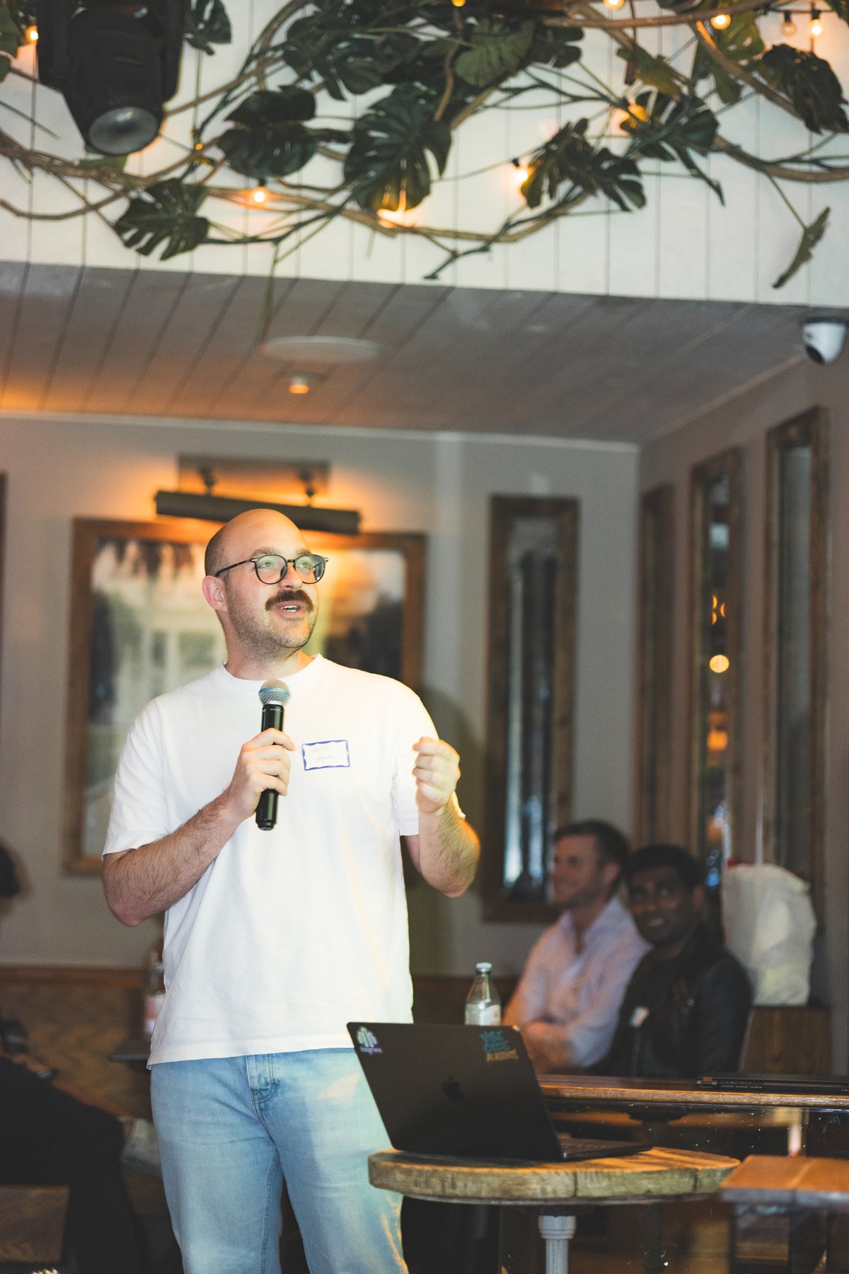 Speaker presenting with laptop