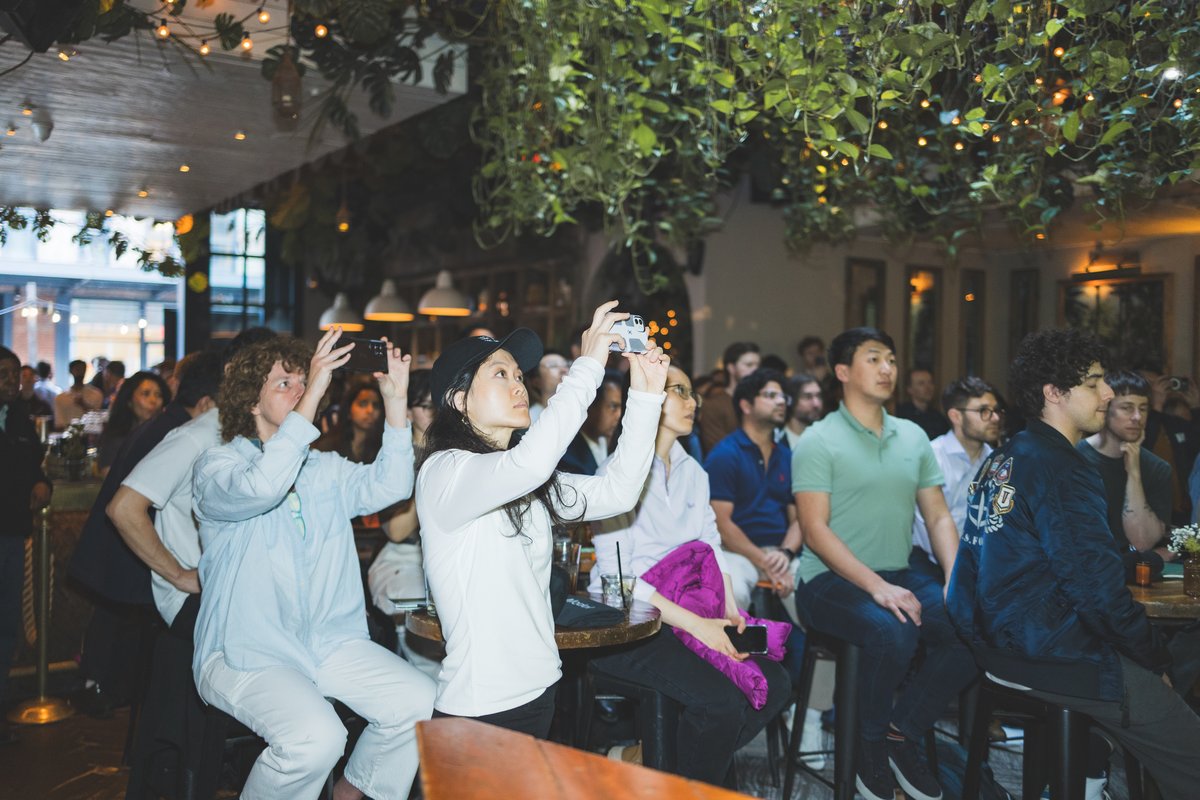 Audience members taking photos