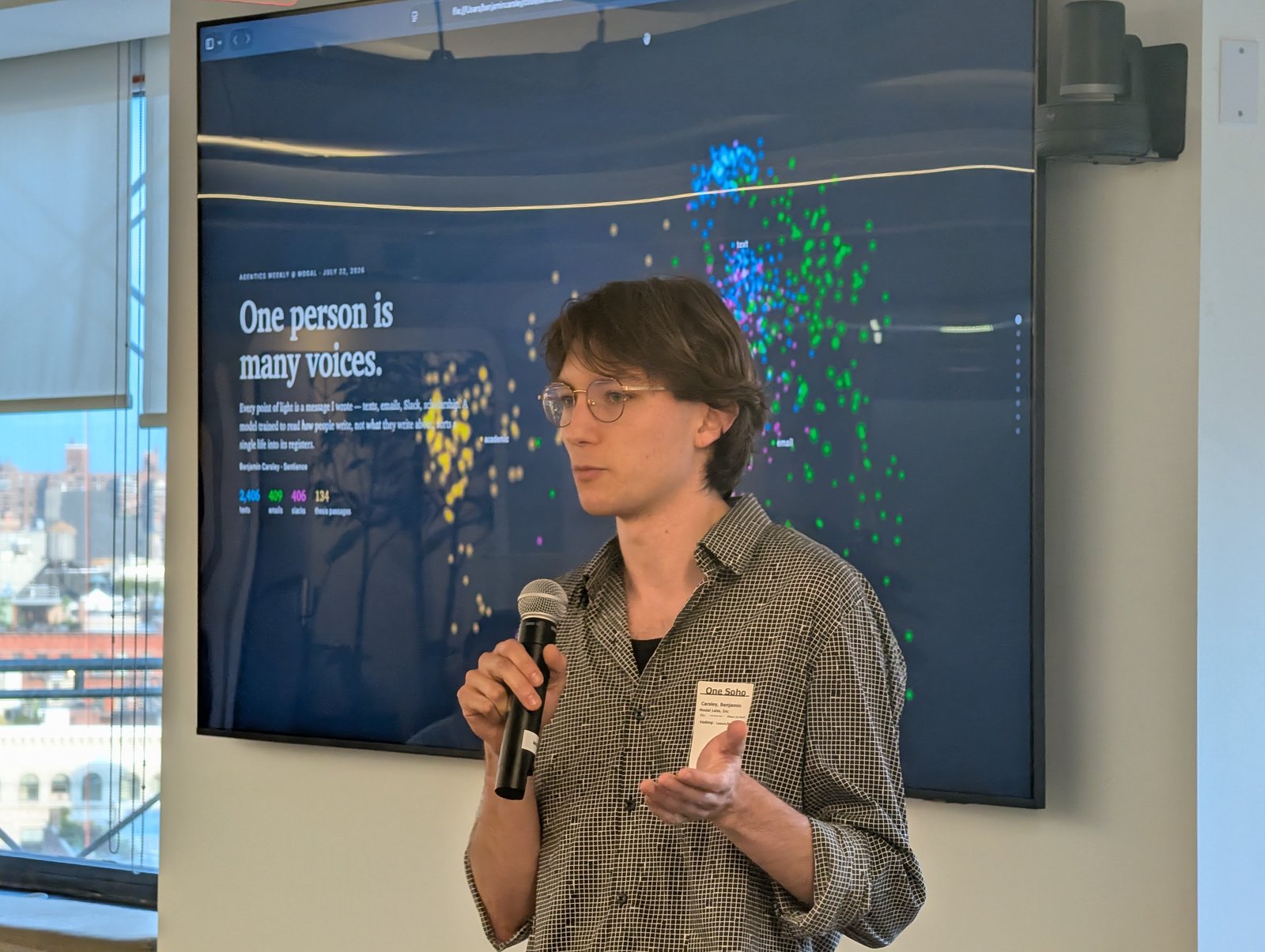 Speaker presenting beside the screen
